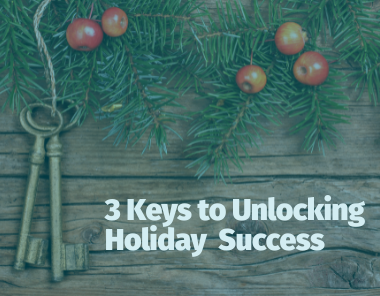 Two antique keys hang from a pine branch with red berries on a wooden background. Text below reads, Three Keys to Plan Your Holiday Marketing—a Human Element guide to unlocking holiday success.