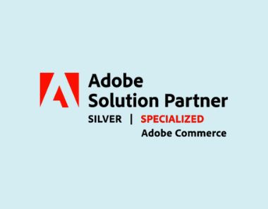 The image displays the Adobe logo alongside the text: Human Element Earns Adobe Commerce Specialization | Adobe Solution Partner SILVER on a light blue background.
